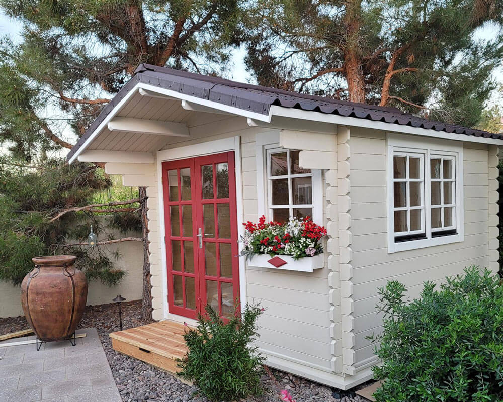 In the first picture with red doors, what type of roofing material is used?  I would love to duplicate this shed!!!